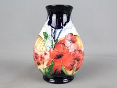 Moorcroft Pottery - a vase decorated in the Forever England pattern,