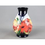 Moorcroft Pottery - a vase decorated in the Forever England pattern,