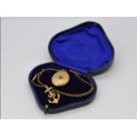 A 9ct gold Front and Back locket on a yellow metal chain (chain A/F) and an Isle of Man brooch