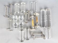 Eleven pairs of knife rests including glass examples, white metal and plated.