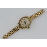A lady's 9ct gold cased, Leda, 17 jewel wristwatch on rolled gold expanding bracelet,