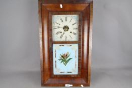 An American Ogee-styled 30-hour weight-driven wall clock, polished mahogany veneer to the case,