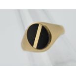 A gentleman's 9ct onyx signet ring, size S + ½, approximately 3.2 grams all in.