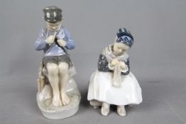 Royal Copenhagen - Two Royal Copenhagen figurines comprising 'Amager Girl Knitting' # 1314 and 'The