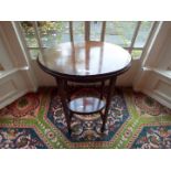 An Edwardian oval top mahogany table with lower gallery,