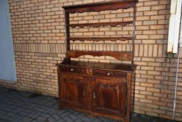 French Dresser - a late 18th century walnut dresser base with two drawers over a pair of pointed