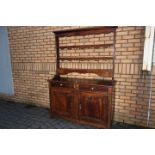 French Dresser - a late 18th century walnut dresser base with two drawers over a pair of pointed