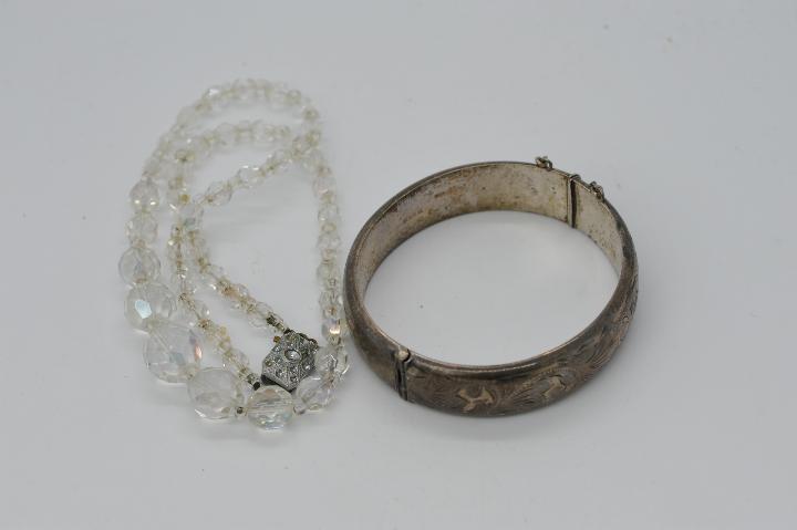 A vintage jewellery box containing a hallmarked silver bangle with safety chain, - Image 3 of 3