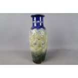 A large Royal Doulton stoneware vase with stylised floral and foliate decoration,