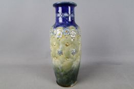 A large Royal Doulton stoneware vase with stylised floral and foliate decoration,