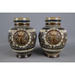 A pair of Victorian Doulton Lambeth VR commemorative jugs, 1879, retailed by J Mortlock & Co,