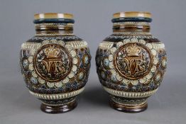 A pair of Victorian Doulton Lambeth VR commemorative jugs, 1879, retailed by J Mortlock & Co,