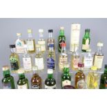 Twenty five whisky miniatures, predominantly Scotch to include Glenlivet, Suntory, Balvenie,