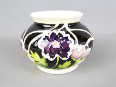 Moorcroft Pottery - a globular vase decorated in the Penny Black pattern, TRIAL piece, approx 9.
