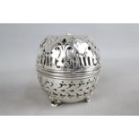 A sterling silver string box of globular form,