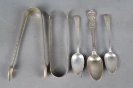 A collection of hallmarked silver items to include Georgian spoons and tongs,