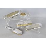 A collection of Swedish plated dressing table items and one silver backed dressing table brush,