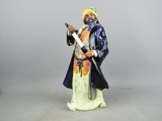 Royal Doulton - a figurine depicting Bluebeard, HN2105 hand painted in blue, purple, orange,