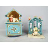 Two Erzgebirge hand painted wooden music boxes.