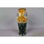 Royal Doulton - An early 20th century stoneware vase with stylised floral decoration against a