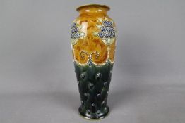 Royal Doulton - An early 20th century stoneware vase with stylised floral decoration against a