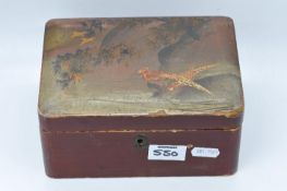 An Asian hand painted jewellery box containing a quantity of costume jewellery to include brooches,