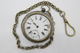 A Swiss, silver, pair cased pocket watch in white metal outer case, outer case approximately 5.