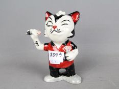Lorna Bailey Pottery - a figurine depicting a Cat entitled 'Dart Player', signed to the base,