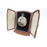 A Victorian yellow metal reversible mourning pendant brooch with a portraits to both sides,