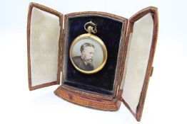 A Victorian yellow metal reversible mourning pendant brooch with a portraits to both sides,