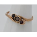 9ct gold - a 9ct rose gold trilogy ring, size u, approximate weight 1.