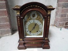 An impressive table clock, oak cased with cast ormulu mounts,