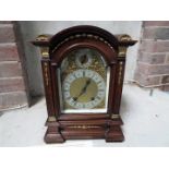 An impressive table clock, oak cased with cast ormulu mounts,