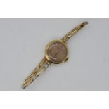 A lady's 9ct, yellow gold cased, Rotary wristwatch on expanding bracelet stamped '9 .