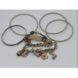Silver 925 - a vintage silver charm bracelet containing nine charms,