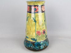 Morris Ware by S Hancock & Son - an early 20th century tall tapered vase hand painted with flowers