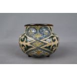 Doulton Lambeth - A small, squat stoneware vase decorated by Minnie G Thompson with foliate scrolls,