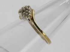 A 9ct yellow gold and diamond ring, size M + ½, approximately 1.8 grams all in.