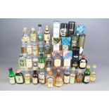 A collection of whisky / whiskey miniatures to include Macallan, Suntory, Glenfiddich, Rosebank,