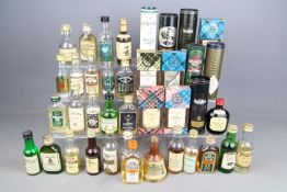 A collection of whisky / whiskey miniatures to include Macallan, Suntory, Glenfiddich, Rosebank,