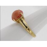 A 9ct yellow gold dress ring set with single pink opal cabochon, opal 1.