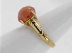 A 9ct yellow gold dress ring set with single pink opal cabochon, opal 1.