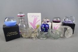 A collection of paperweights to include Perthshire glass,