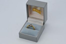 A 22ct gold ring set with a cluster of diamonds, size L, approximately 4 grams all in.