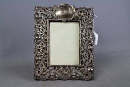 An Art Nouveau silver and leather, easel back photograph frame,