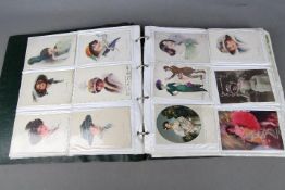 Deltiology - an album containing approximately 240 early period postcards to include female
