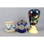 Royal Doulton, Doulton Lambeth - Two stoneware tobacco jars,