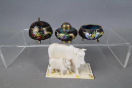 A miniature cloisonné cruet set, and a bone model depicting buffalo (A/F).