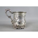 A Victorian hallmarked silver tankard with embossed foliate and floral decoration,