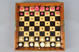 A Jaques & Son 'In Statu Quo' travelling chess set with natural and red stained pieces,